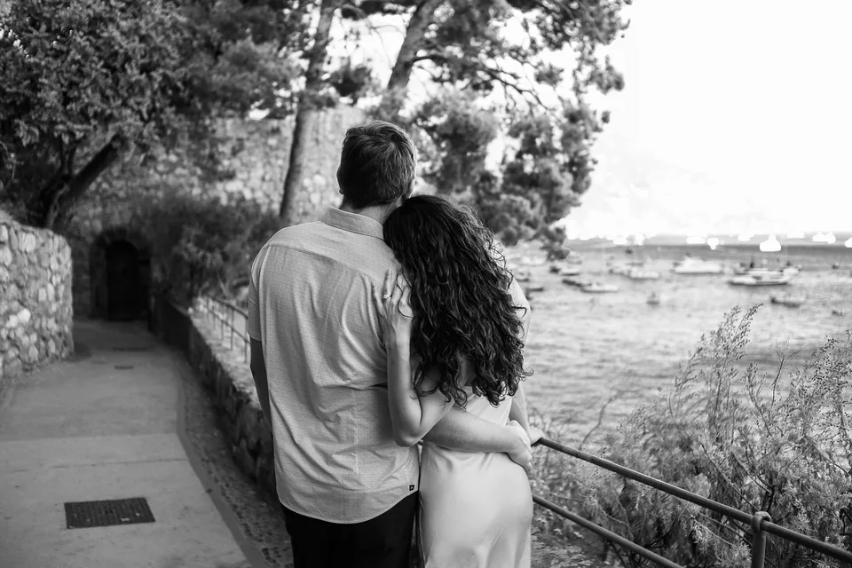 Black and white couple walking by the sea