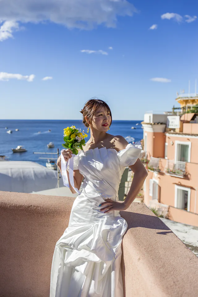 Bridal portrait by a coastal railing
